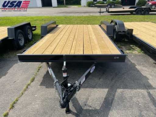 2023 American manufacturing operations 18ft wood deck car hauler trailer w/ 2 axle brake